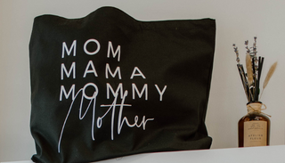 Mom Mama Mommy Mother black bag next to a dried herb arrangement